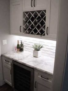 custom designed alcove with wine rack and refrigerator