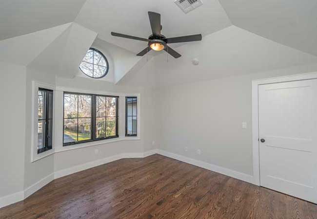 Custom ceiling treatment with circular window and fan