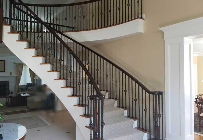 Dramatic circular staircase to the upper level