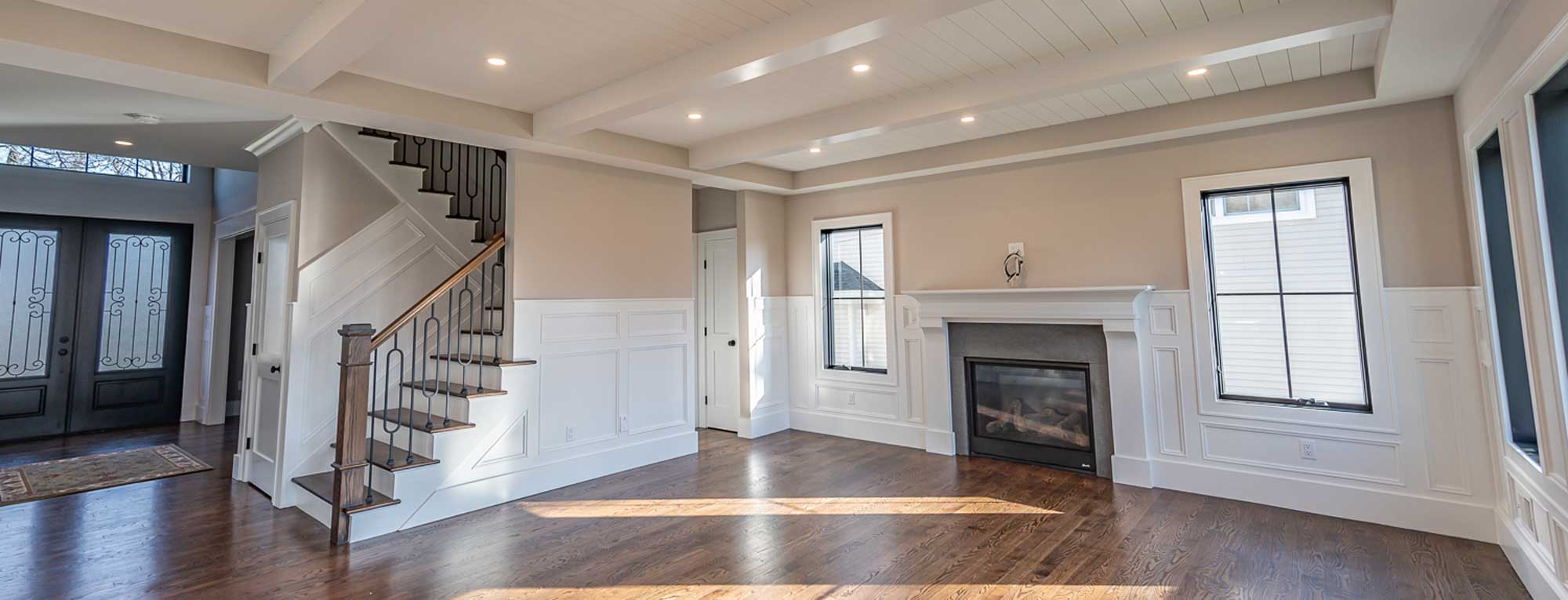 open-entry-into-family-room-with-fireplace